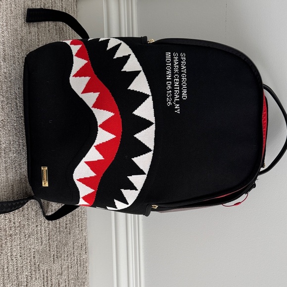 Sprayground Black Backpack with Vibrant Red Interior - Picture 1 of 6